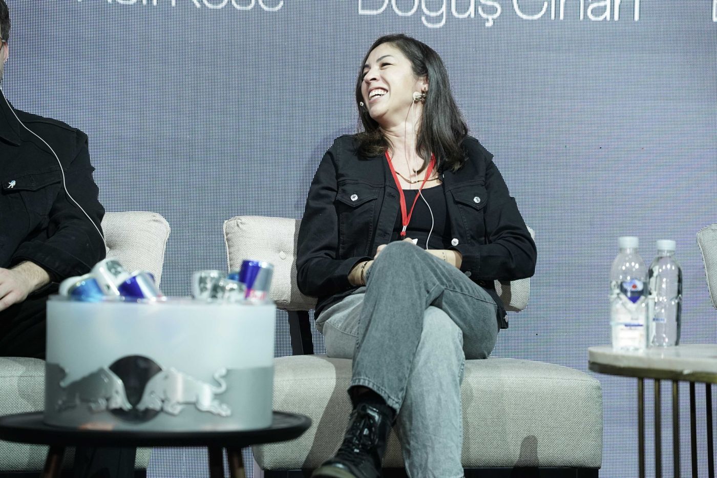 A panelist laughing on stage