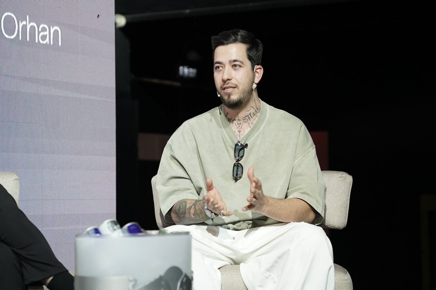 A panelist speaking on stage